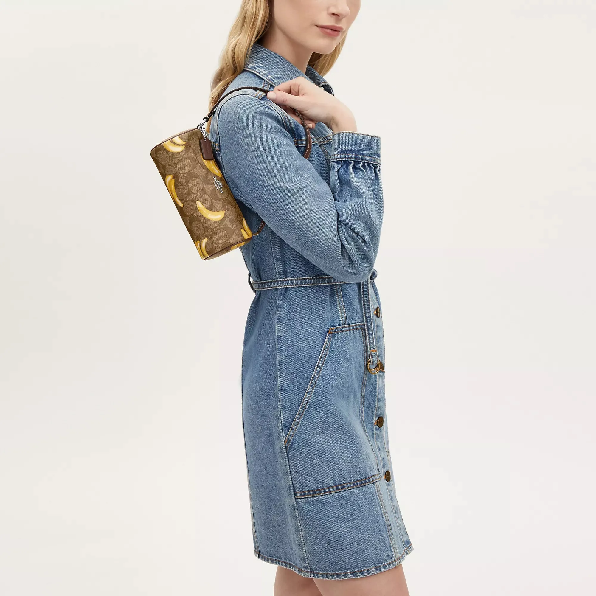 Coach Outlet Nolita Barrel Bag In Signature Canvas With Banana Print