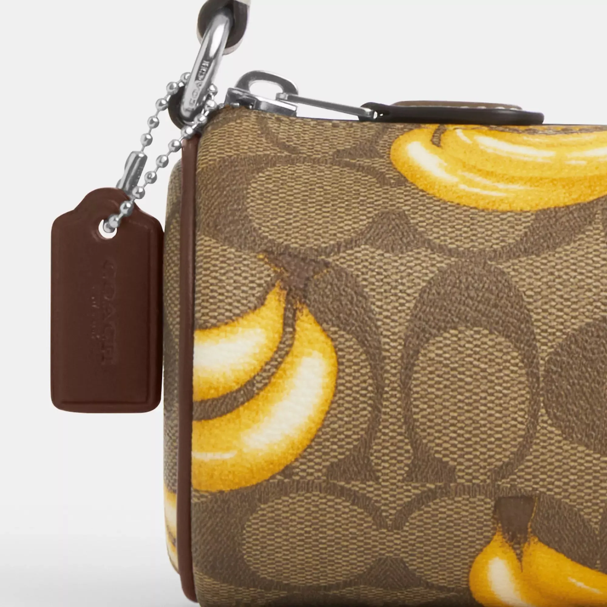 Coach Outlet Nolita Barrel Bag In Signature Canvas With Banana Print